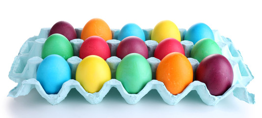 Colorful Easter eggs in tray isolated on white