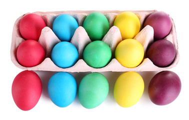 Colorful Easter eggs in tray isolated on white