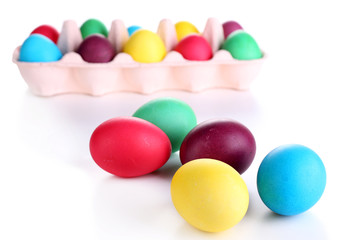 Fototapeta na wymiar Colorful Easter eggs in tray isolated on white