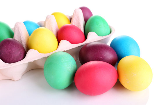 Colorful Easter eggs in tray isolated on white