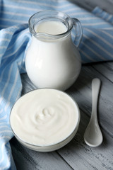 Dairy products on wooden table background