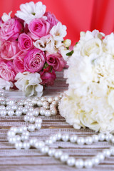 Beautiful wedding bouquets on table on fabric background