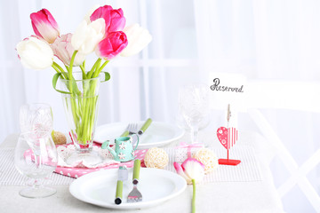 Beautiful spring table setting on light background