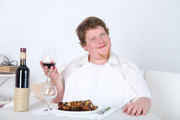 Tasty lunch for fat man, on home interior background
