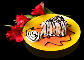 Tasty cake with cream, on black background © Africa Studio