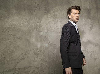 Adult businessman wearing the black suit