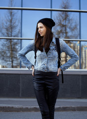 Fototapeta premium cute brunette teenage girl in hat, student outside