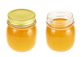 Closed and opened honey jar