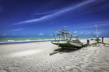 Small fishing boat on the beach of Natal, Brazil