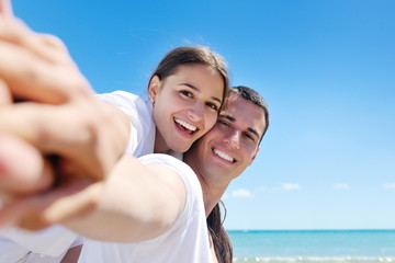 Fototapeta premium happy couple have fun on the beach