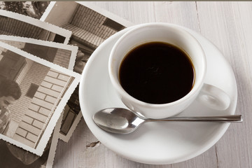 Memories. Cup of coffee and old photos
