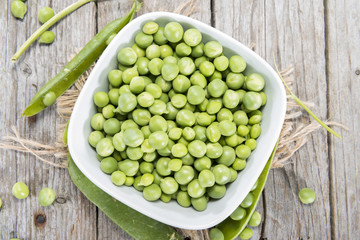 Fresh Peas on wooden background