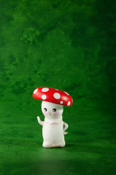 cute puppet handmade, one mushroom, green background