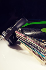 Gramophone records and headphones.