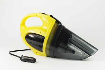 Car high power vacuum cleaner on the light background