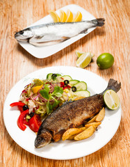 Fried trout and potato wedges