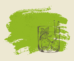 Iced tropical cocktail with mint on green grunge background