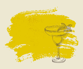 Tropical yellow cocktail with mint on yellow grunge background