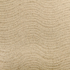 Fototapeta na wymiar Textured wavy yellow sand