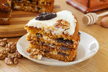piece of honey cake with plum and walnut
