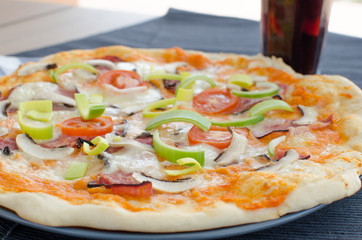 Home made pizza with soda