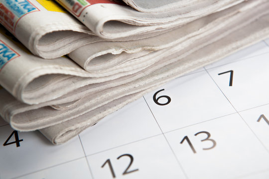 stack of newspapers and calendar
