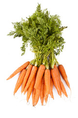 stacked fresh carrots on white background, vegetables