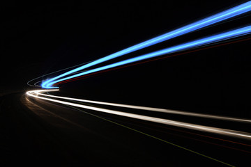 Car light trails in the tunnel.