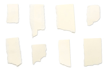 ripped yellow pieces of paper, isolated on white