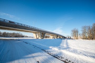 Bridge over railroad. Winter landscape.