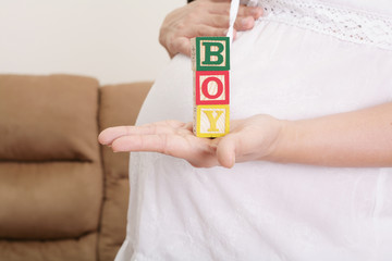 pregnant woman having the word 