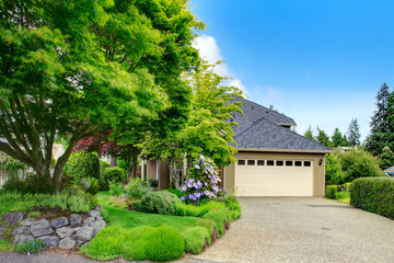House exterior. Garage and driveway view
