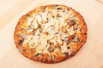 Chicken pizza on wooden cutting board