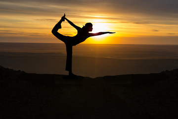 Outdoor sunrise yoga girl