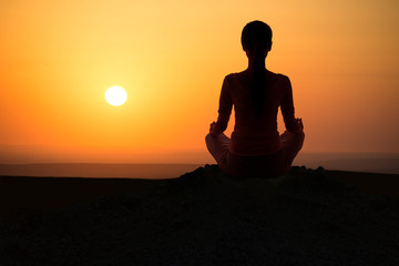 Outdoor sunrise yoga girl