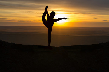 Outdoor sunrise yoga girl