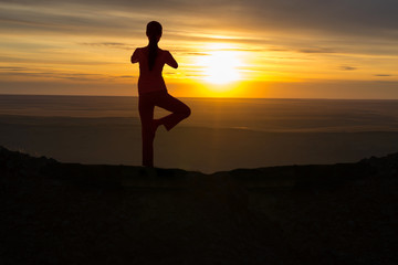 Outdoor sunrise yoga girl