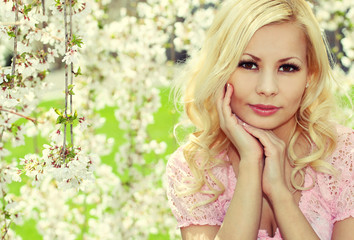 Obraz na płótnie Canvas Blonde Girl with Cherry Blossom. Spring Portrait.
