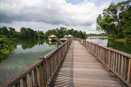 Wooden pier with boats in Singapore