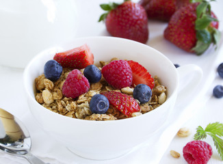 Breakfast homemade granola with summer berries.