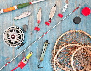 fishing tackle on a wooden table