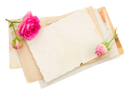 bunch of old papers with roses