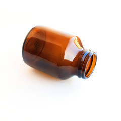 old brown glass medicine bottle isolated on white