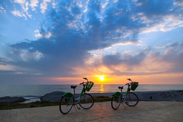 Obraz na płótnie Canvas Two bicycles on Batumi beach