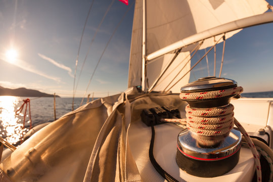 Winch with rope on sailing boat