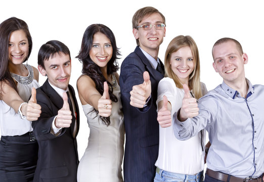 friendly team of young professionals shows gesture "thumbs up"