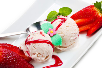 Strawberry ice cream with fruits close up