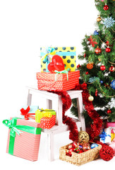 Fototapeta na wymiar Decorated Christmas tree with gifts isolated on white