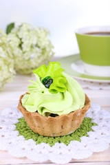 Tasty cake on table on light background