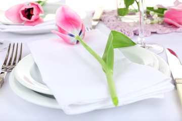 Table setting with spring flowers close up